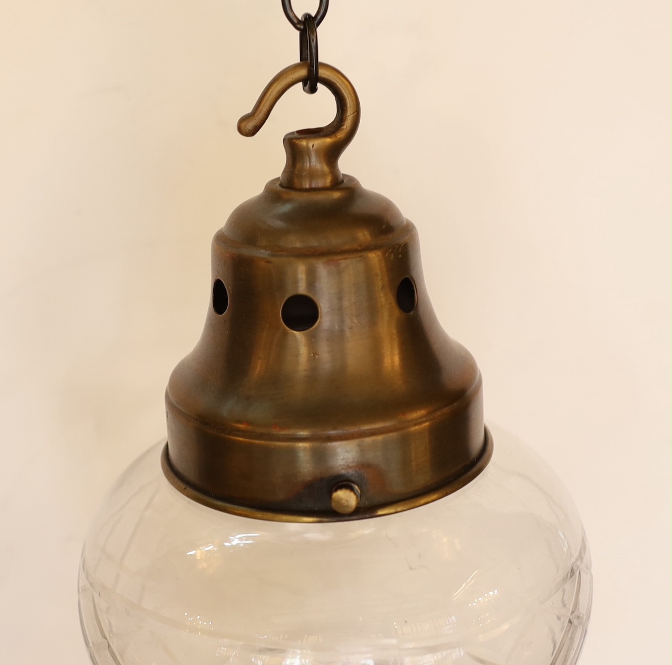 A bronze metal and cut glass light pendant, height 28cm